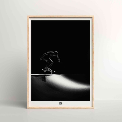 Black and white photo of a skateboarder ready to go down a ramp. Skateboard wall poster for interior design. Black and white photo of a skateboarder ready to go down a ramp. Skateboard wall poster for interior design.