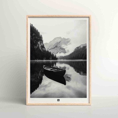 Black and white photo of a pontoon on the edge of a lake between the mountains. Design wall poster for modern decor. Black and white photo of a pontoon on the edge of a lake between the mountains. Design wall poster for modern decor.