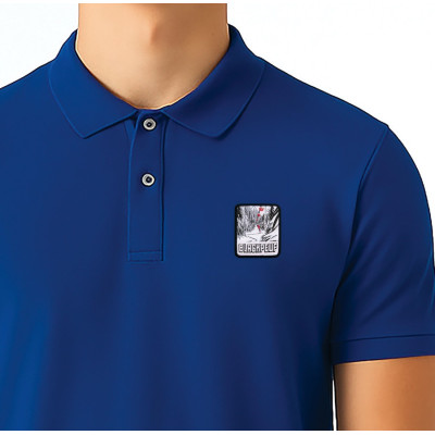Blue Blackpeuf polo in organic cotton – mountain fashion with iconic illustrated patch