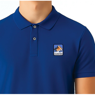 Blue Blackpeuf polo in organic cotton – mountain fashion with iconic illustrated patch