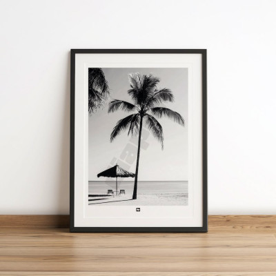 Design wall poster in black and white of a moment of idleness between palm trees, beach and parasol. Design wall poster. Design wall poster in black and white of a moment of idleness between palm trees, beach and parasol. Design wall poster.