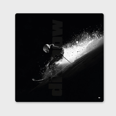 Black and white photograph of a skier in powder snow, contrasting white snow and black background.