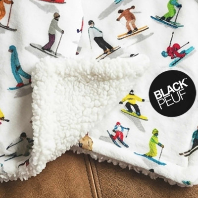XL white throw blanket, soft and thick, featuring colorful skiers.