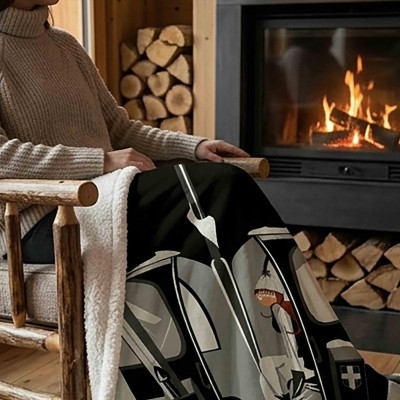 XL white throw blanket, soft and thick, draped over the legs of a woman sitting on a chair in front of a mountain fireplace.